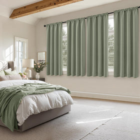 MIULEE sage green blackout curtains in bedroom setup with soft ambient light.