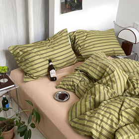 Mixinni olive-taupe stripes fabric closeup highlights soft, airy cotton texture.