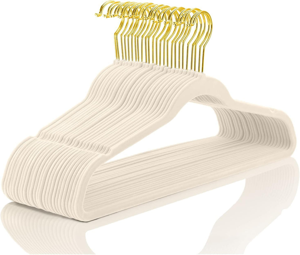 MIZGI velvet hangers 30-pack in ivory with gold hooks for durable space-saving closet organization.