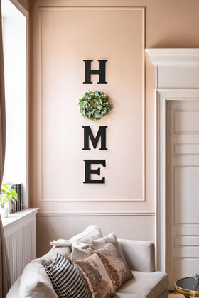 Mkono Farmhouse wall sign Wreath O with eucalyptus accent for a welcoming look.