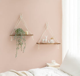 Mkono macrame shelves in boho ambience showcasing plant and photo display