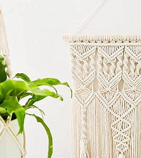 Mkono wall hanging displayed in a cozy bedroom setting.