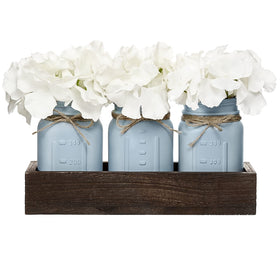 Mkono mason jar centerpiece with wood tray adds rustic charm to dining tables.