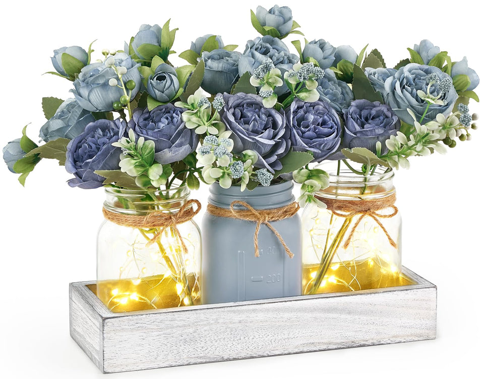 Mkono mason jar lights centerpiece on a wooden box adds warm dining room ambiance.