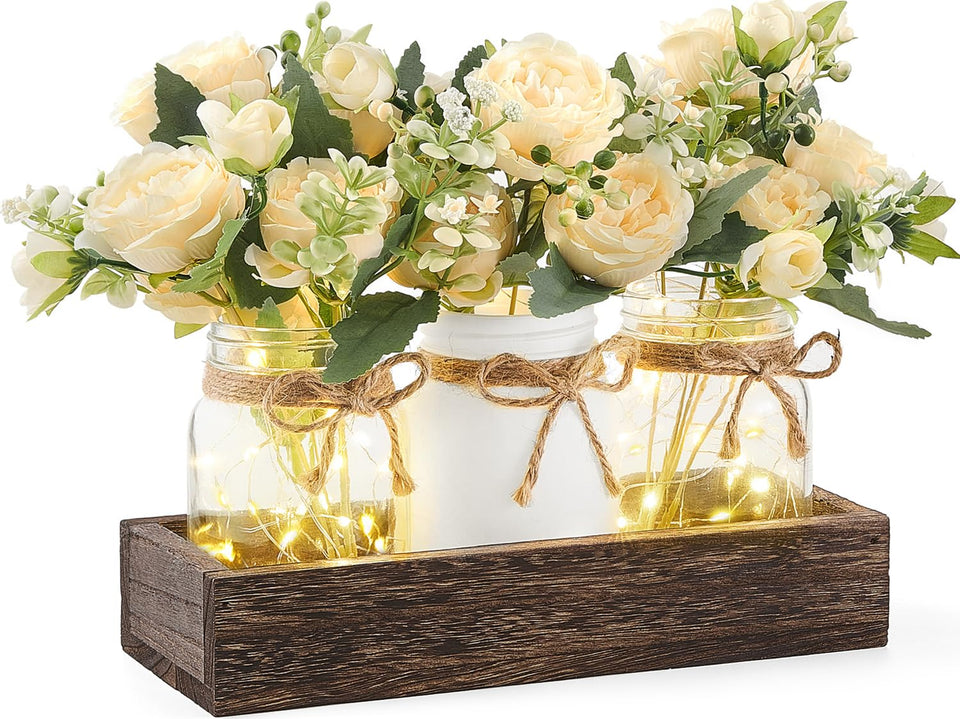 Mkono mason jar lights centerpiece on wood tray adds warm rustic charm.
