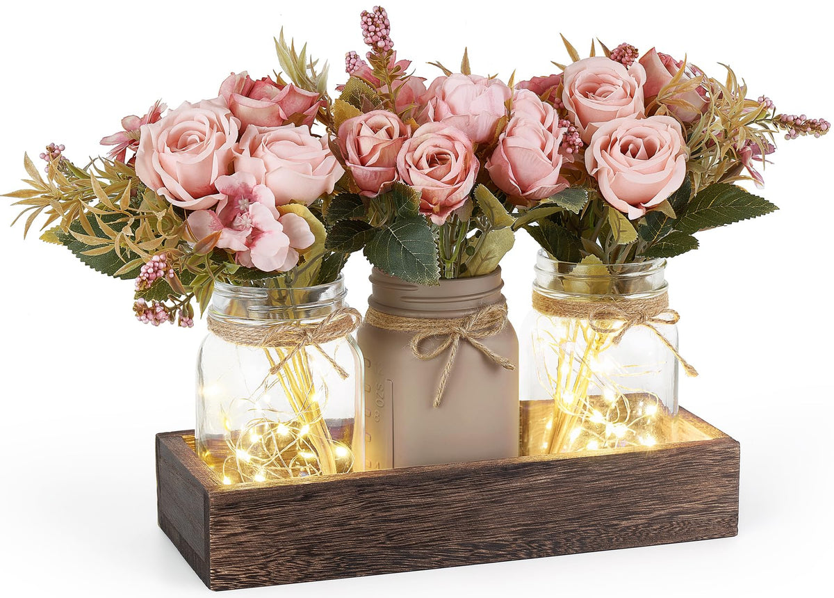 Mkono mason jar lights centerpiece on a wood box for rustic dining ambiance