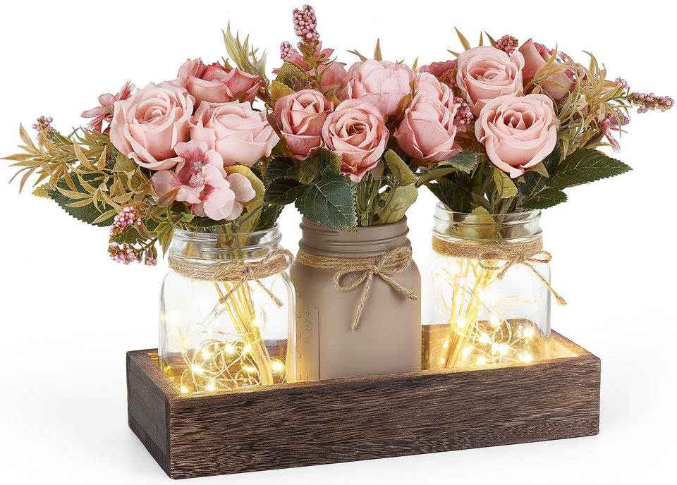 Mkono mason jar lights centerpiece on a wood box for rustic dining ambiance