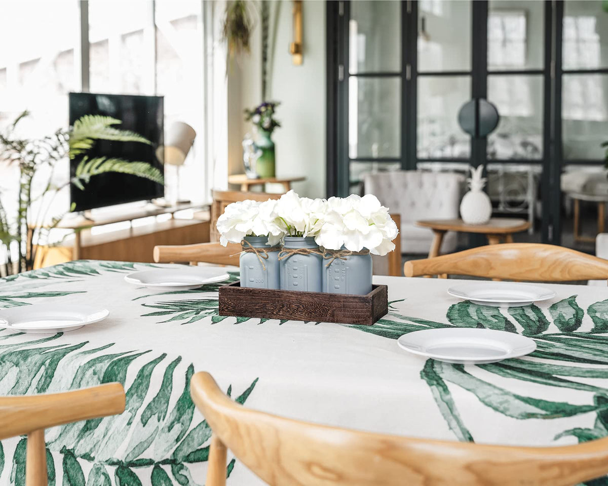 Mkono painted mason jars with artificial flowers brighten living rooms.