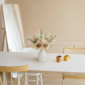 Mkono ceramic vase with vertical stripes complements modern rustic home styling.