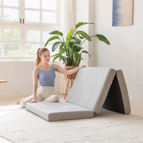 MLILY Tri-Fold Topper folded compact for travel and guest-ready comfort.