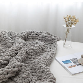 MocaDng Decorative Blanket on couch enhances texture and vibrant living room style.