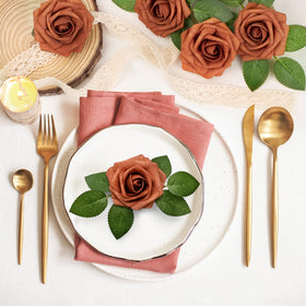Mocoosy wedding centerpieces featuring burnt orange roses for warm ambiance