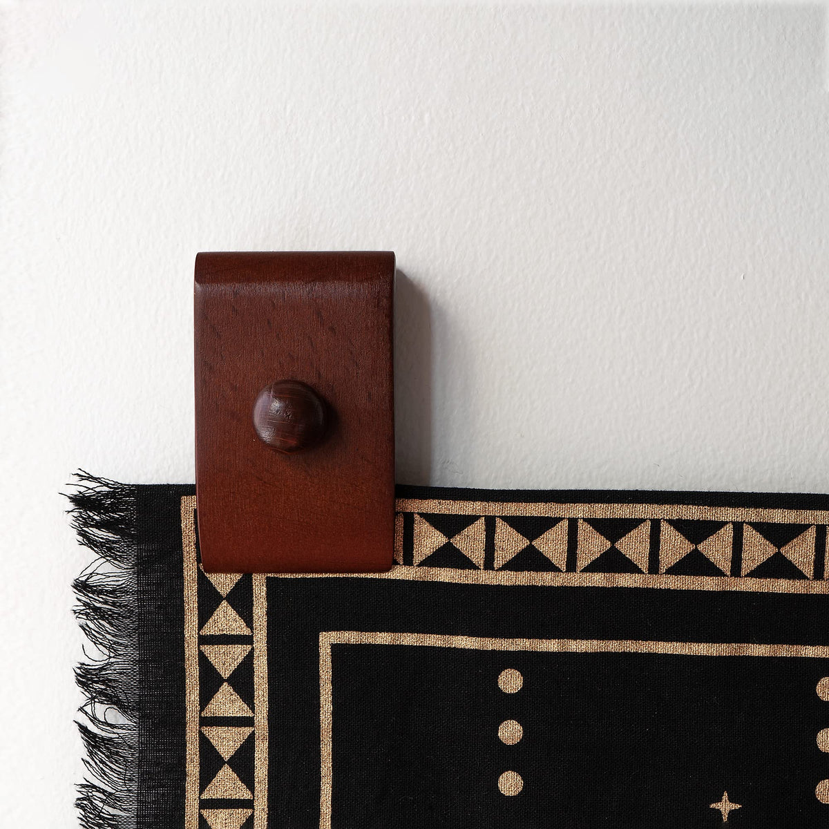 MOCTUS rug hanger helps wall-display or organize woven pieces on any wall.