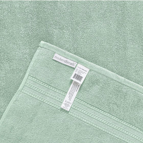 Modern Threads Artesia Damask Sage towel set on a bathroom display.