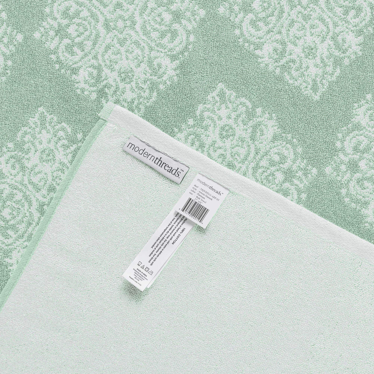 Modern Threads Artesia Damask Sage washcloth showing fast-drying performance.