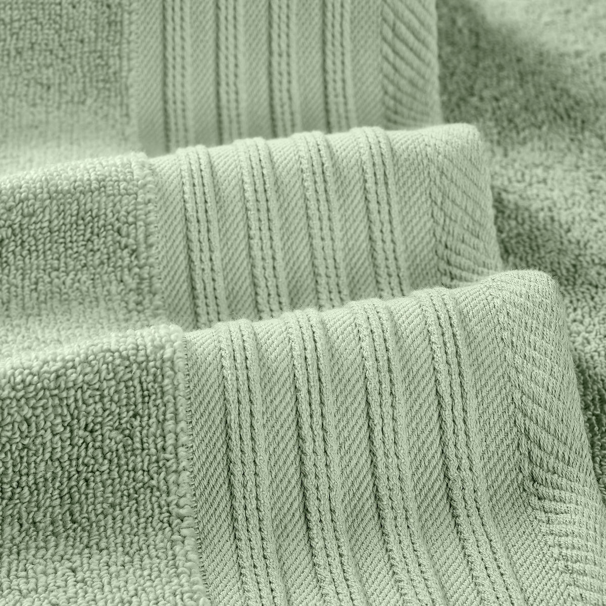 Close view of geometric olive pattern on Modern Threads towel detail.