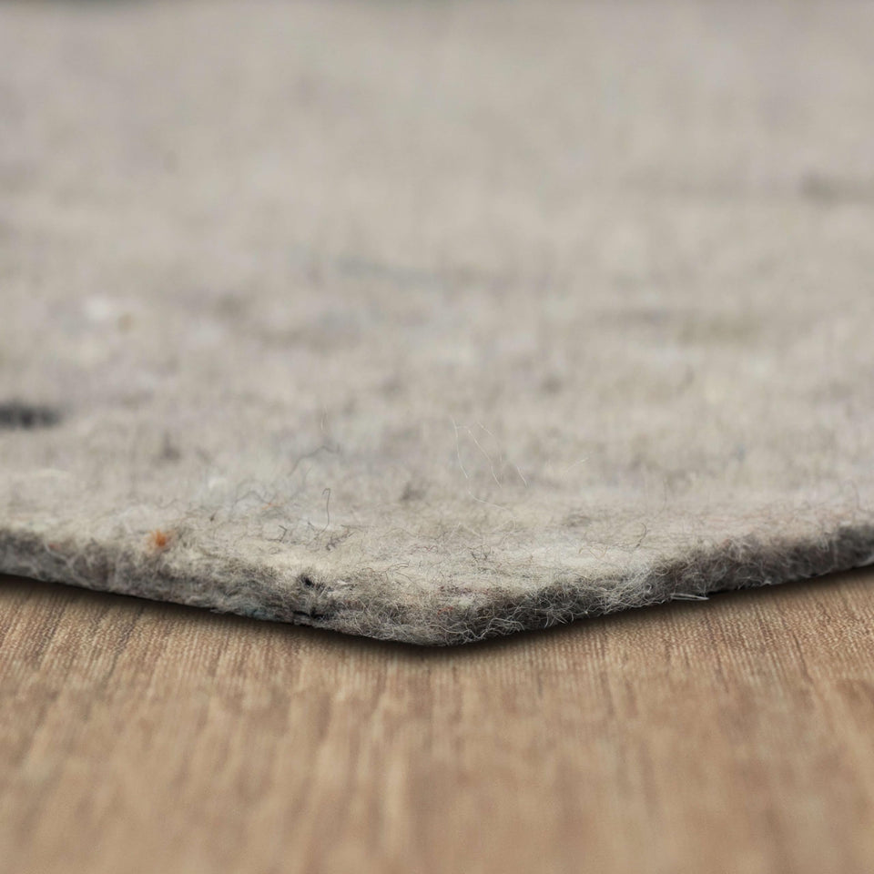 Mohawk Home felt rug pad underlay for 7x9 rug adds cushioned support.