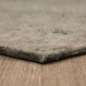 Mohawk Home felt rug pad 8x10 cushion close-up shows plush underfoot comfort and floor protection.