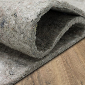 Mohawk Home felt rug pad protects floors under heavy furniture cushions.