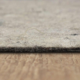 Green Label Plus certified Mohawk Home rug pad for low emissions.