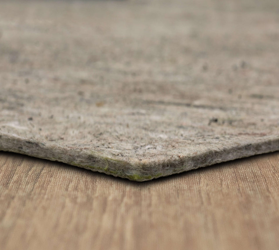 Mohawk Home non-slip rug pad 7x10 firmly grips hardwood and tile for steady rugs.