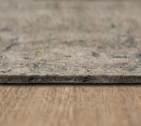 Mohawk Home Under hardwood floor arrangement reduces noise and protects surfaces.