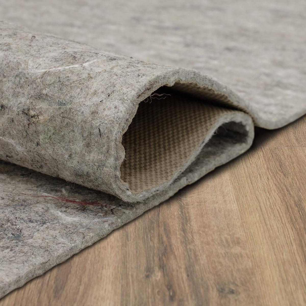 Mohawk Home sound insulation effect under rug subtly reducing floor noise
