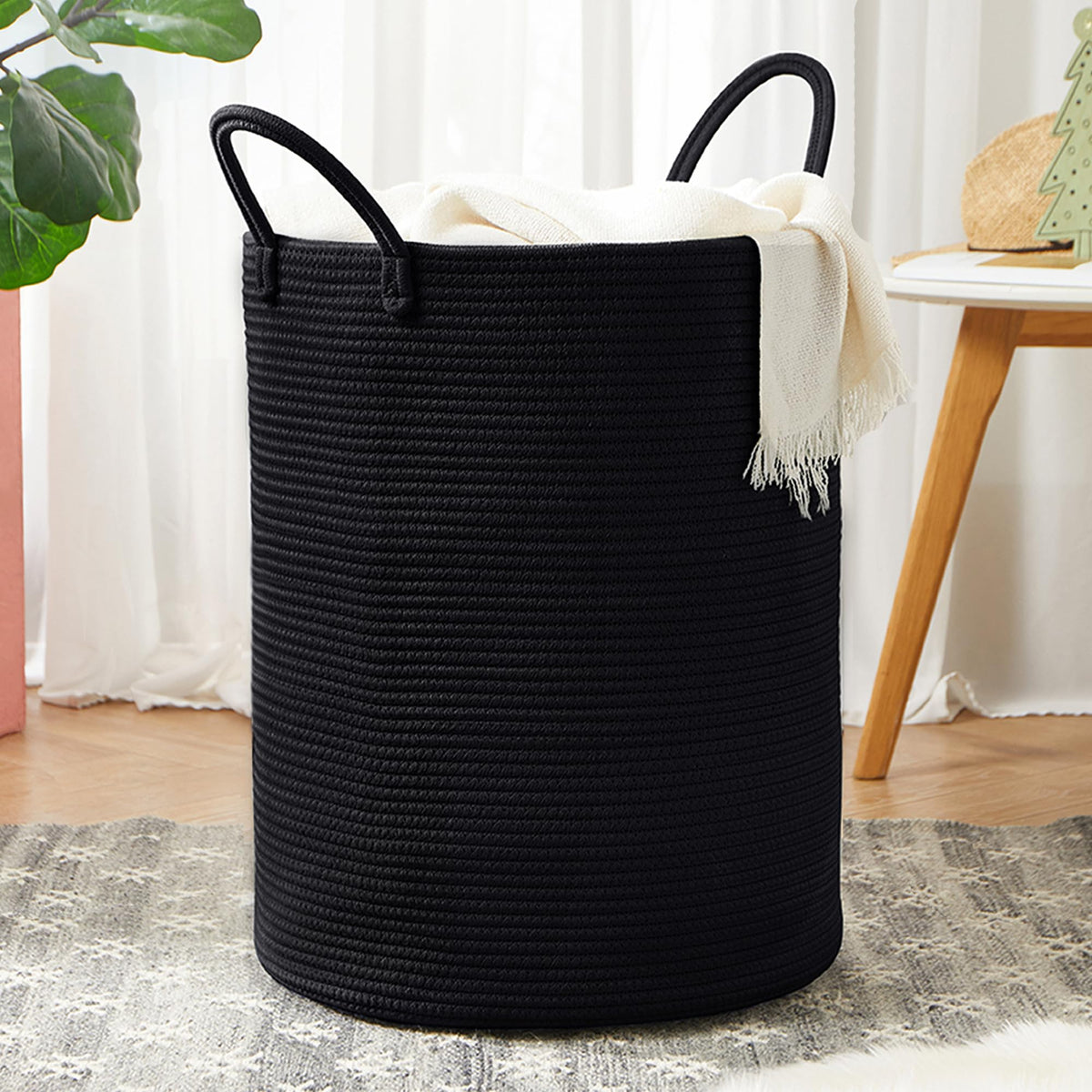 MOJOSCEND 60L black woven cotton rope laundry hamper angled view for easy laundry drop