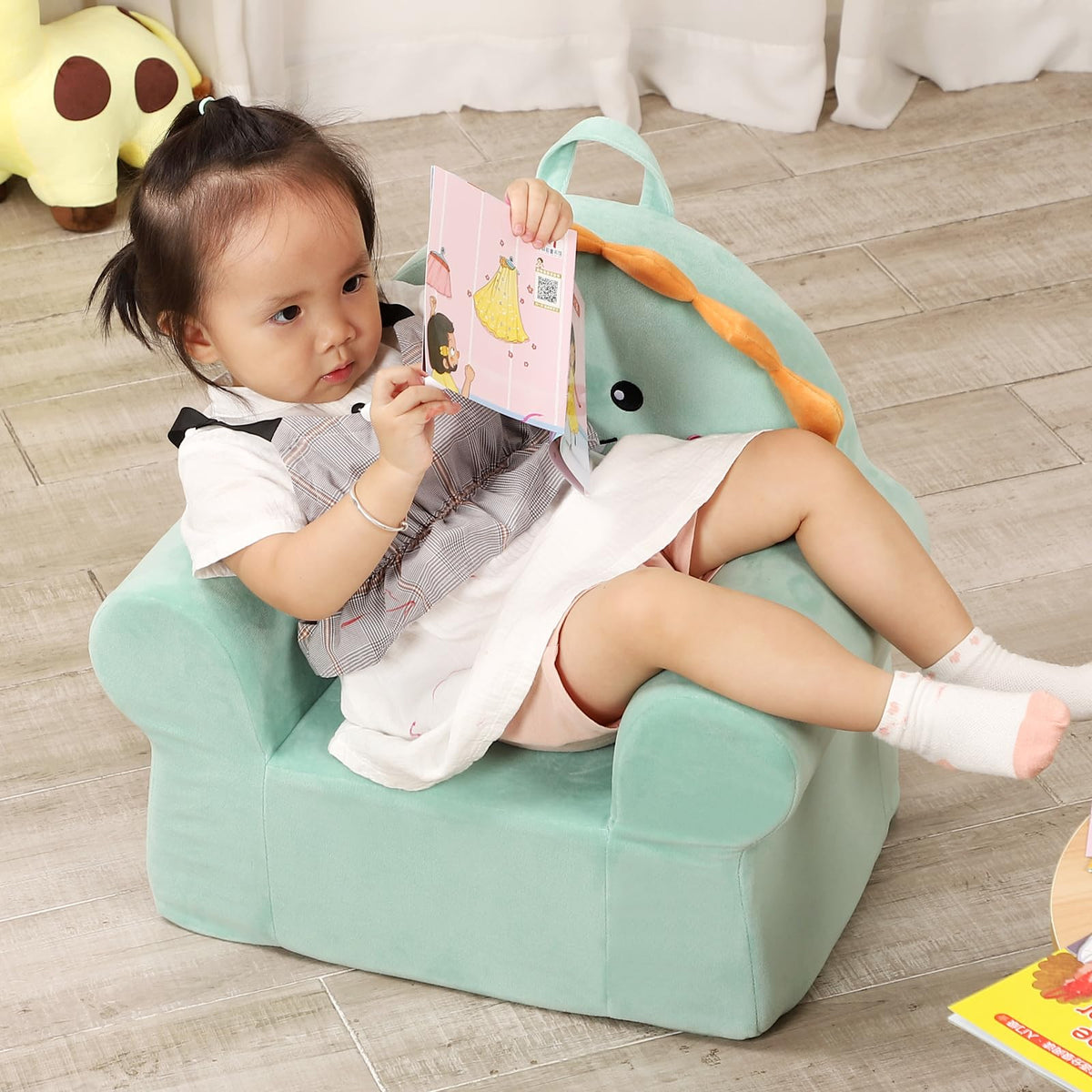 MOMCAYWEX Cuddly Toddler Chair with dinosaur motif supports comfy seating during stories