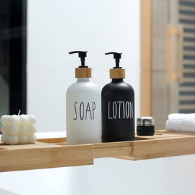MOMEEMO bathroom countertop display with glass dispensers and natural accents.