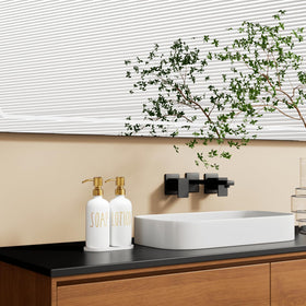 MOMEEMO lotion dispenser pump highlights the two-tone glass on the vanity.