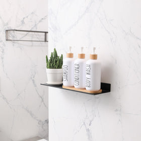 MOMEEMO white conditioner dispenser bottle atop bamboo tray keeps bath organized.