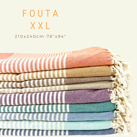 MOMOMUS flatweave Turkish towel sea green with fringes adds artisanal charm.