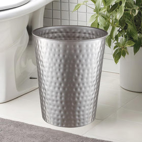 Monarch Abode sleek metal wastebasket adds decorative flair to a room.