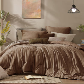 Monbix king size comforter set in brown on a bed, offering year-round warmth and plush loft.