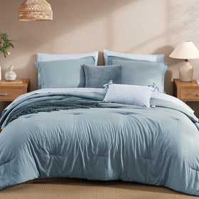 Monbix Queen Comforter in dusty blue with plush fill for year-round comfort.