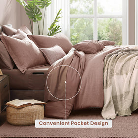 Monbix queen shams in dusty pink completing a coordinated bed setup.