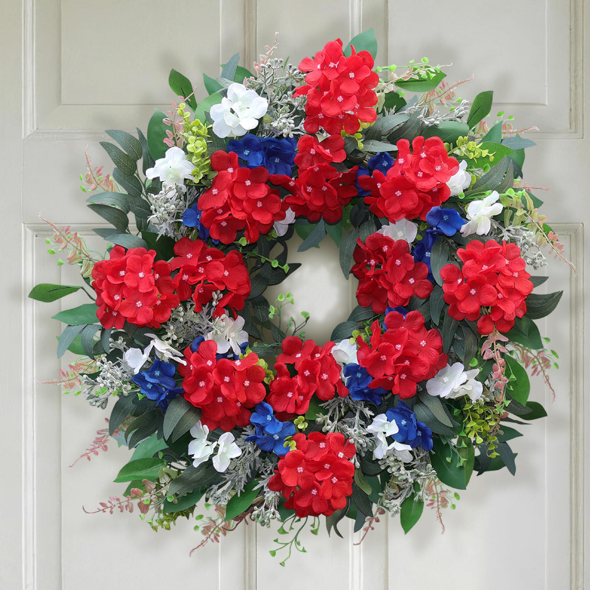 Montekin 24-inch patriotic wreath on the front door for durable seasonal curb appeal.