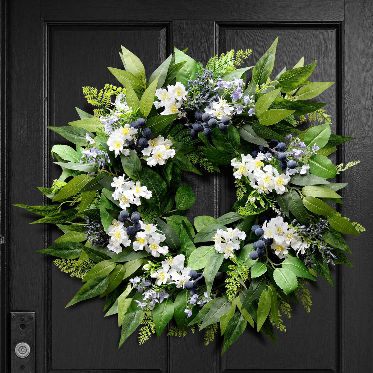 Montekin blueberry wreath on the front door adds year‑round curb appeal.