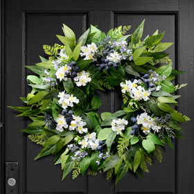 Montekin blueberry wreath on the front door adds year‑round curb appeal.