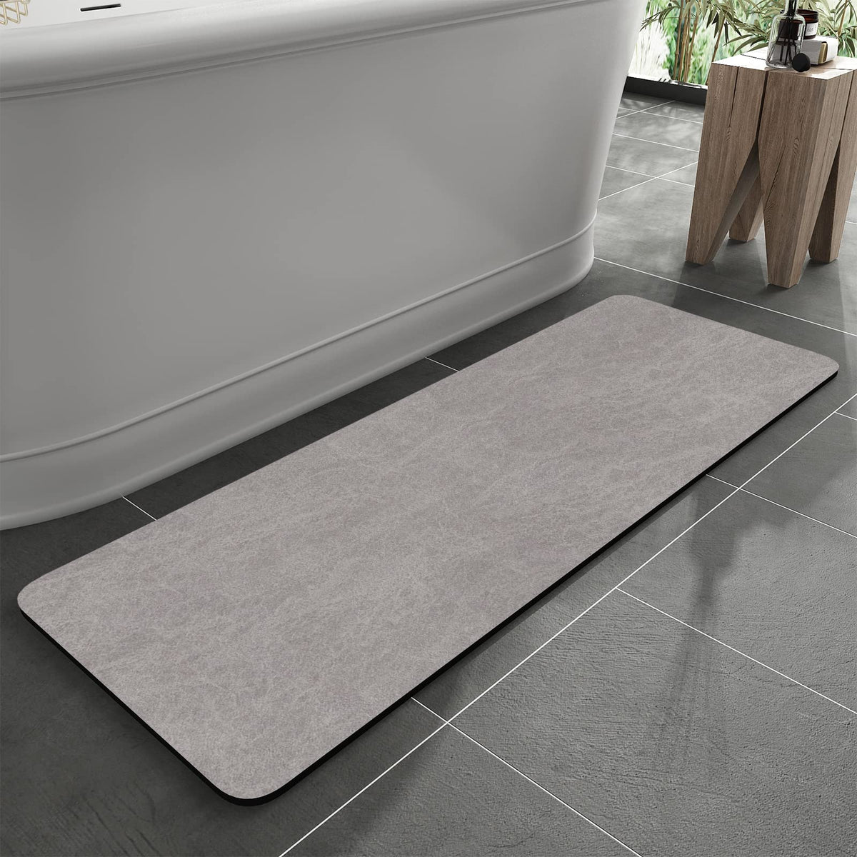MontVoo bath mat with rubber backing for secure grip on wet floors.