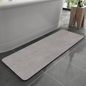MontVoo bath mat with rubber backing for secure grip on wet floors.