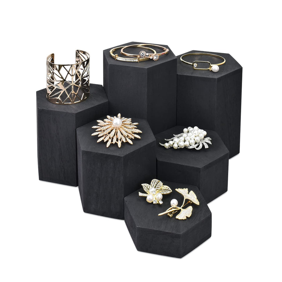 Mooca wooden hexagon risers 6pc with varied heights elevate rings and necklaces attractively.