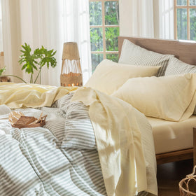 MooMee flat sheet in butter yellow shows linen-like texture and softness.