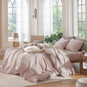 MooMee bedding on bed scene evokes calm, resort-like ambiance.