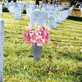 Moriahan weather-resistant headstone vase keeps flowers neatly upright.