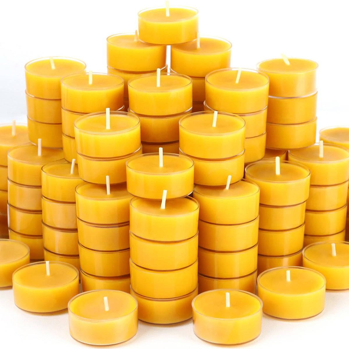 MOSROAD beeswax tealights in clear cups offer a clean, long-lasting glow for intimate dinners.