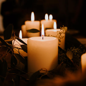MOSROAD ivory pillar candle on outdoor table with wind caution