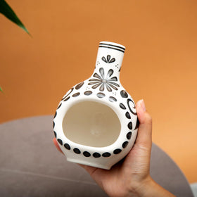 MOUGIGI handcrafted Palo Santo burner on table adds safe, compact aromatherapy.