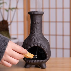Detail of floral patterns on MOUGIGI Palo Santo holder